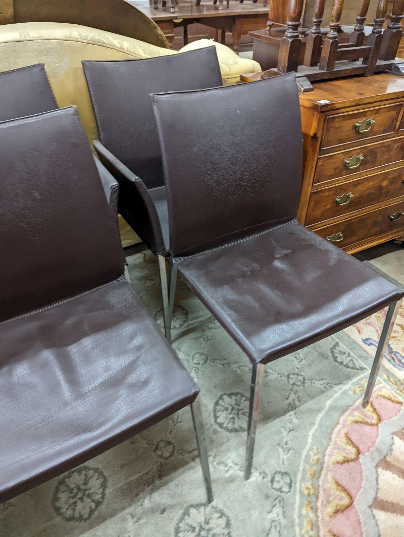 A set of six contemporary brown leather dining chairs